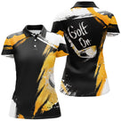 Polo golf noir et jaune orange femme avec motif GOLF ON et figure de golfeuse
