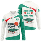 T-shirt ping pong femme col rond vert et blanc avec raquette rouge et logo pongiste circulaire