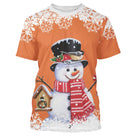 Pull noël variante festive orange avec bonhomme de neige charmant, oiseau et maisonnette