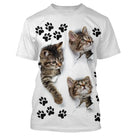 T-shirt chat 3D blanc avec trois chatons tigrés émergeant de déchirures et empreintes de pattes noires all-over