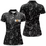 Polo de golf femme noir sacs de clubs all-over lettrage GOLF orange coupe ajustée féminine