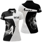 Polo golf femme noir silhouette golfeur swing flamme fumée blanche coupe cintrée tissu respirant