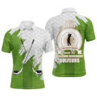 Polo golf homme blanc texture balle de golf éclats vert prairie clubs croisés médaillon golfeur slogan meilleurs golfeurs