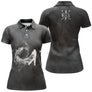 Polo golf femme noir tourbillon fumée blanche silhouette golfeur swing tire balle inscription GOLF coupe cintrée