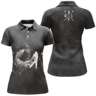 Polo golf femme noir tourbillon fumée blanche silhouette golfeur swing tire balle inscription GOLF coupe cintrée