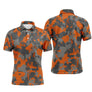 Polo golf homme camouflage orange vif noir intense gris urbain silhouettes golfeurs swing voiturettes intégrées all-over