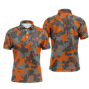 Polo golf homme camouflage orange vif noir intense gris urbain silhouettes golfeurs swing voiturettes intégrées all-over
